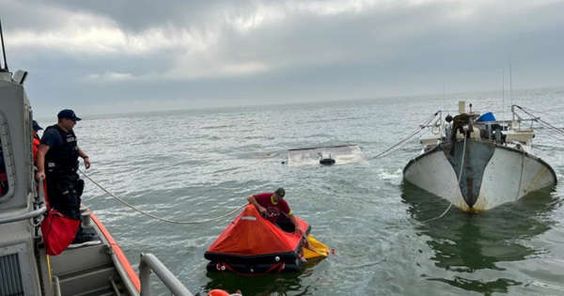 USCG officials rescues three boaters in the Gulf Of Mexico USCG officials rescues three boaters in the Gulf Of Mexico