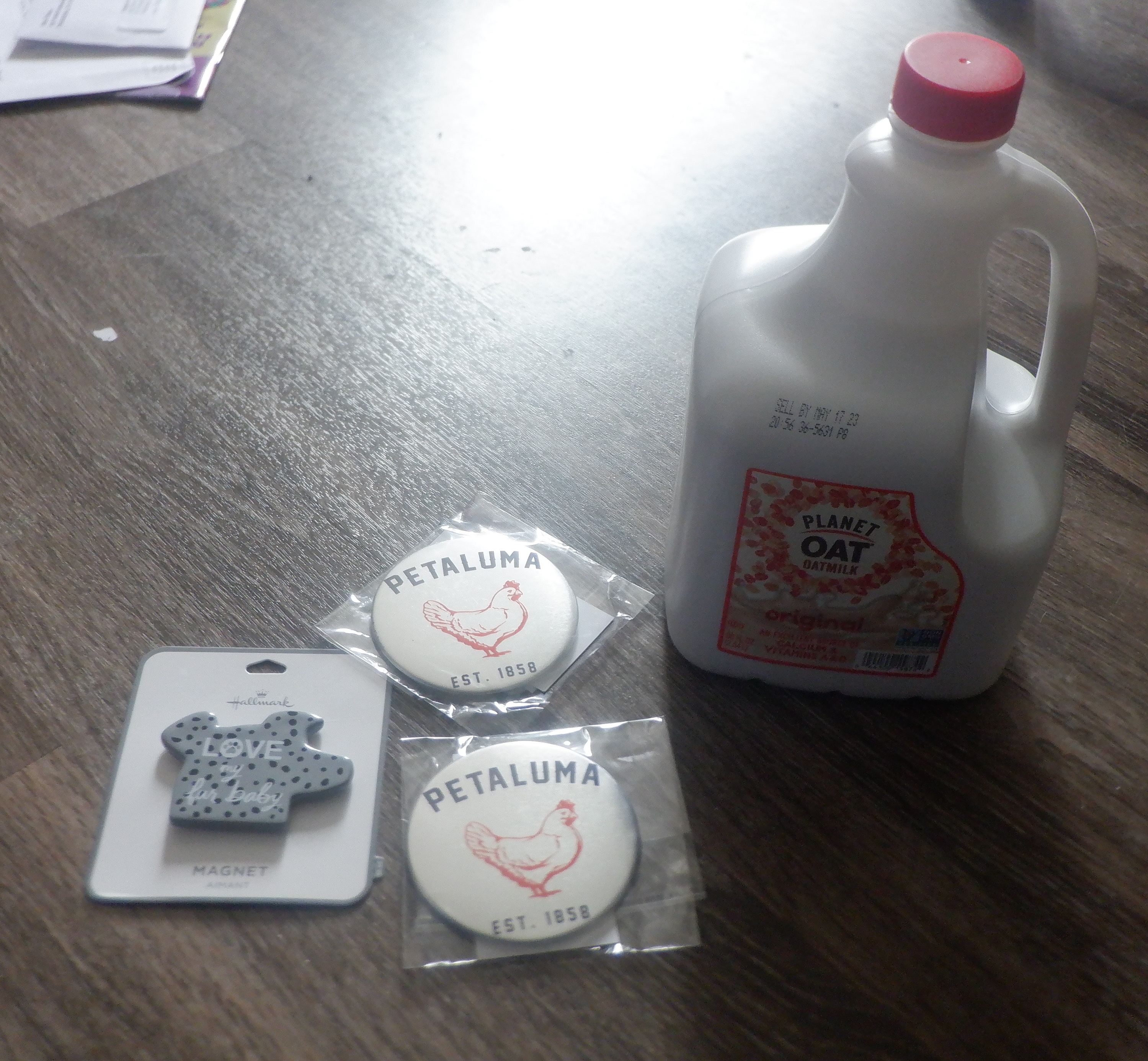 Milk and magnets that I bought while I was out Milk and magnets that I bought while I was out