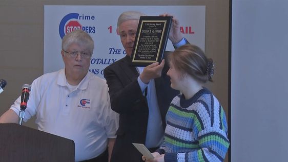 Teen heroine Lillian Flanders on the right awarded for her act of heroism 