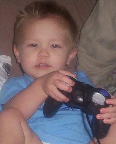 Mad Grandson - This is my 3 year old grandson (he was 2 here). He was trying to play a video game, I was trying to take photos. I got in his way of the TV, he got upset at me and was saying something. Im sure he was mumbling something about moving out of his way. Look, you can see his face and that he was upset at me.....hehehehe