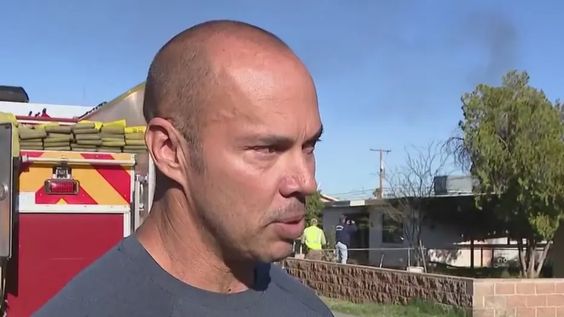 Retired firefighter Dana Lambert rescues two girls from a house fire.