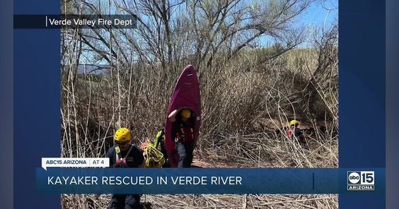 Firefighters in Verde Valley Arizona rescuing a female kayaker in trouble. Firefighters in Verde Valley Arizona rescuing a female kayaker in trouble.