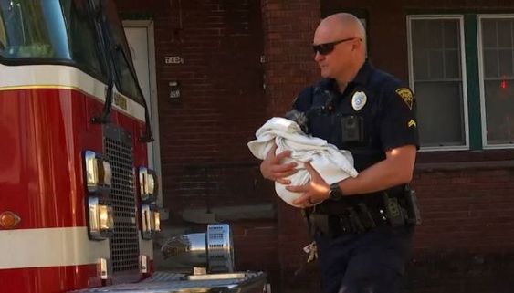 West Virginia firefighter saving a dog in a house fire in Huntington on Wednesday