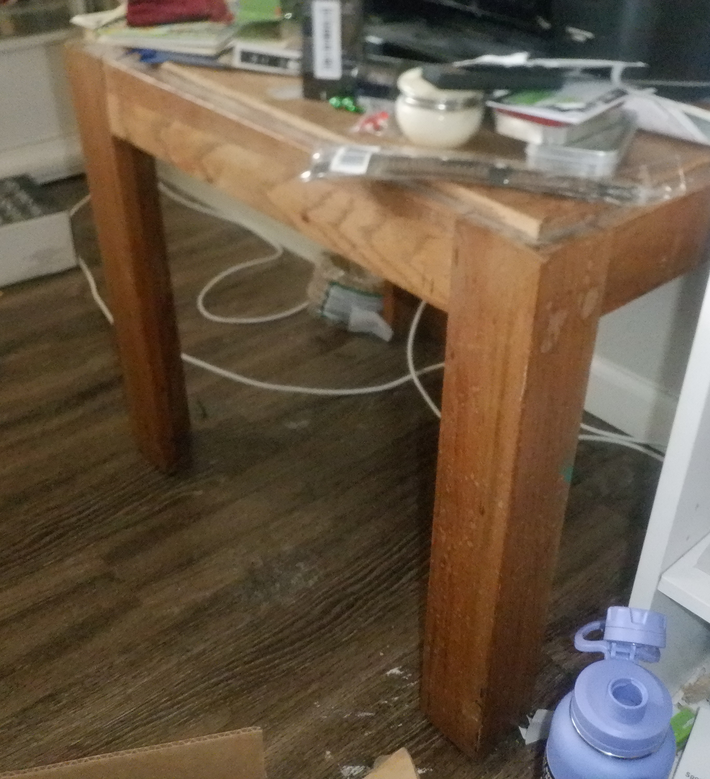 "After" photo of table with stuff cleaned out from under it. "After" photo of table with stuff cleaned out from under it.