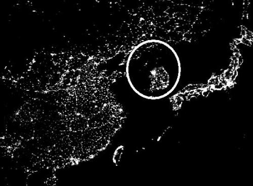 North Korea - The Korean peninsula provides one of the starkest contrasts between digital haves and have-nots. South Korea (seen here in the lower half of the circle) is one of the heaviest users of broadband technology in the world, while neighboring North Korea (in the upper half of the circle) has a near-total lockdown on Internet access. In an article Monday in The New York Times (registration required), Julien Pain of the censorship-tracking group Reporters Without Borders says of North Korea, 'It is by far the worst Internet black hole.'  This satellite photo from NASA's Visible Earth project shows the region at night, with the bright spots indicating electricity usage. To the right of the circle are the islands of Japan, to the left is the eastern portion of China, and at bottom is the island of Taiwan.