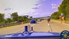Cowboys capturing a loose cow on Interstate 75 in Oakland County MI Cowboys capturing a loose cow on Interstate 75 in Oakland County MI
