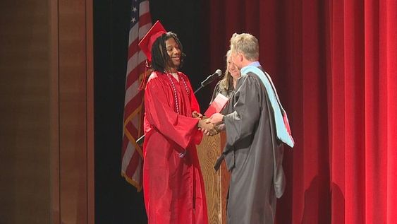 Harvey Shelton receiving his high school diploma on Monday