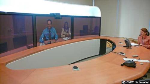 Television Programme - The TelePresence product requires a dedicated room that comes equipped with three flat-panel high-definition televisions, a table shaped in a semicircle, a microphone and speakers, and cameras. The idea is that people will virtually sit across from each other.  Within the system, each HDTV needs to support 1080p resolution. 1080 represents 1,080 lines of vertical resolution, while the letter p stands for progressive scan, or noninterlaced. Today's most popular HDTVs are 720p resolution. Credit: Marguerite Reardon