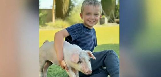 Colton Zajac with the piglet known as Lucky