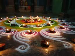 https://commons.wikimedia.org/wiki/File:Rangoli_with_small_lamps_in_a_puja_at_a_temple_2.jpg