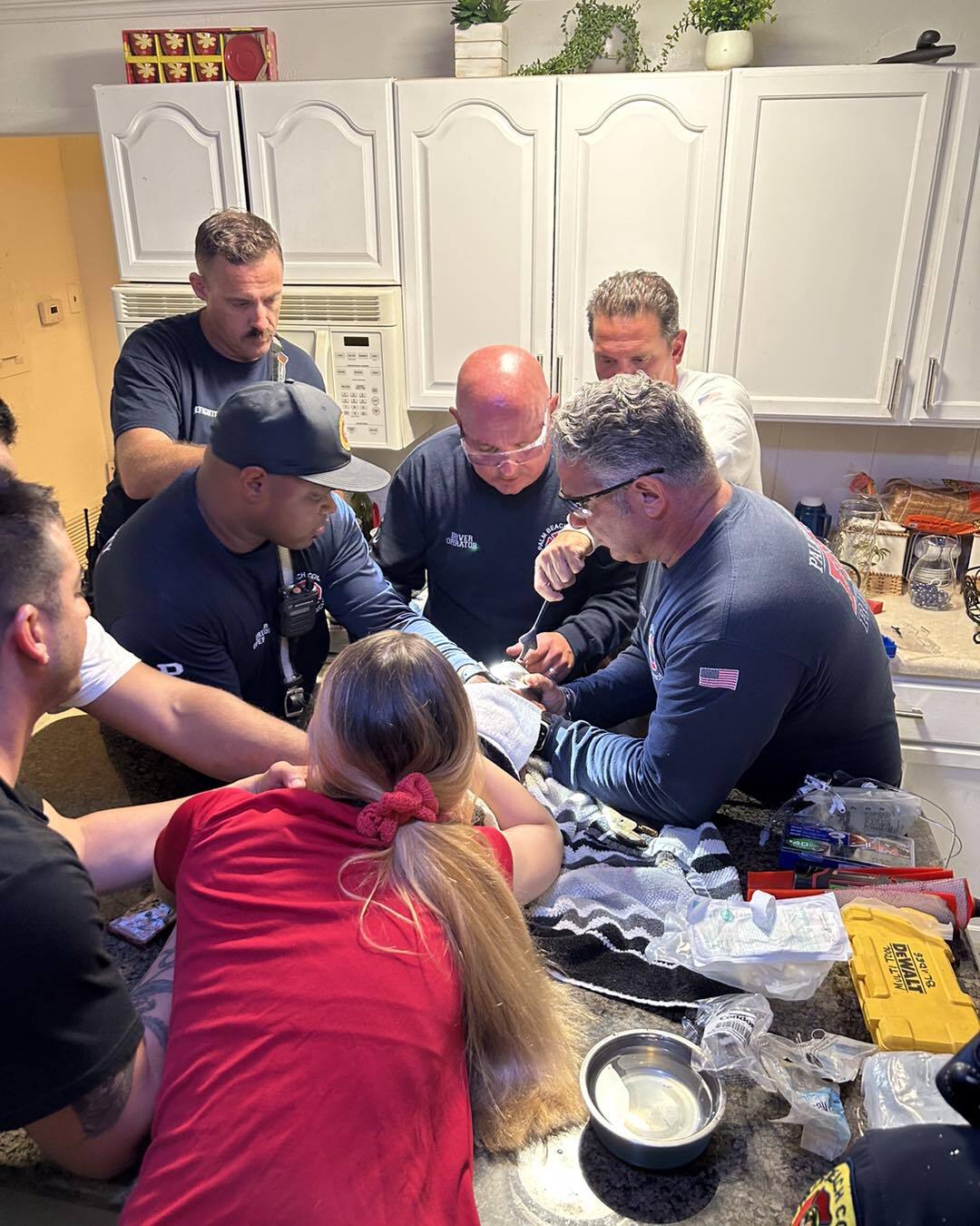 Palm Beach County firefighters working on freeing a dog that had her paw caught on a drain Palm Beach County firefighters working on freeing a dog that had her paw caught on a drain