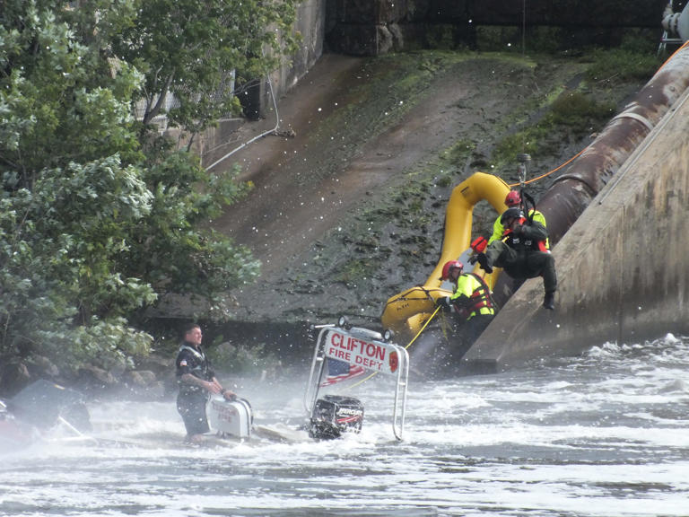 New Jersey state police rescue firefighters who were in the Passaic River New Jersey state police rescue firefighters who were in the Passaic River