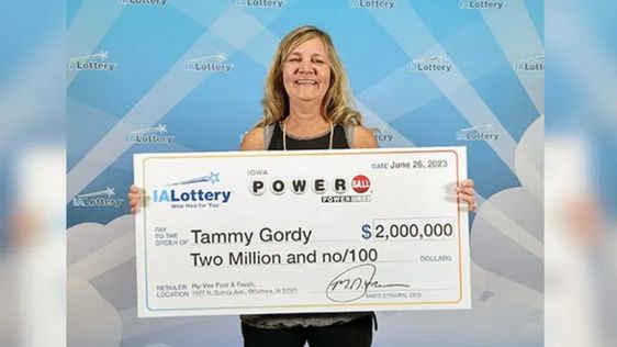 Iowa resident Tammy Gordy with her winning lottery prize. Iowa resident Tammy Gordy with her winning lottery prize.