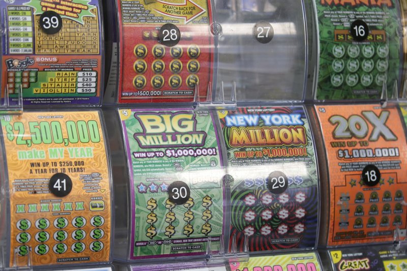 Scratch off lottery tickets in a rack. Scratch off lottery tickets in a rack.