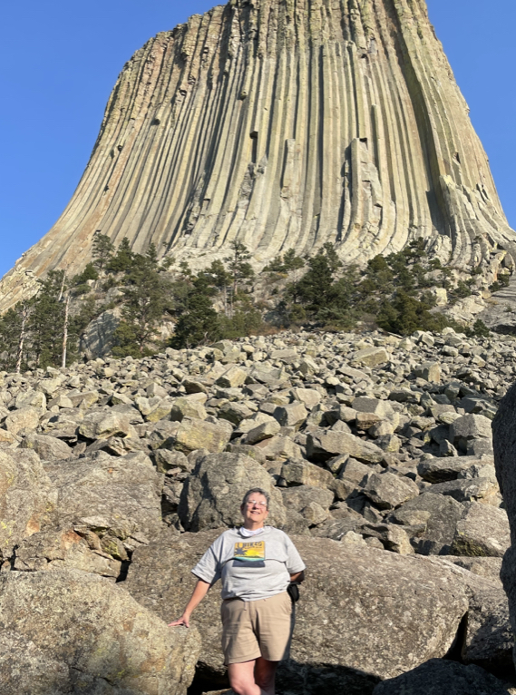 Me at Devil’s Tower, Wyoming.  Photo taken by a fellow tourist on my iPhone. 