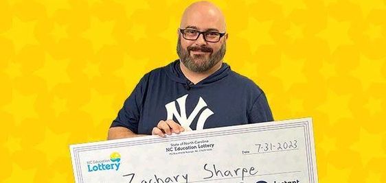 Lottery winner Zachary Sharpe with his lottery prize in North Carolina