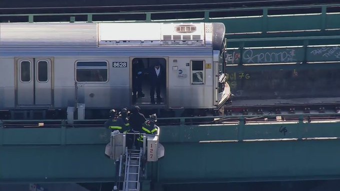 FDNY using a ladder to rescue passengers aboard a passenger train in New York