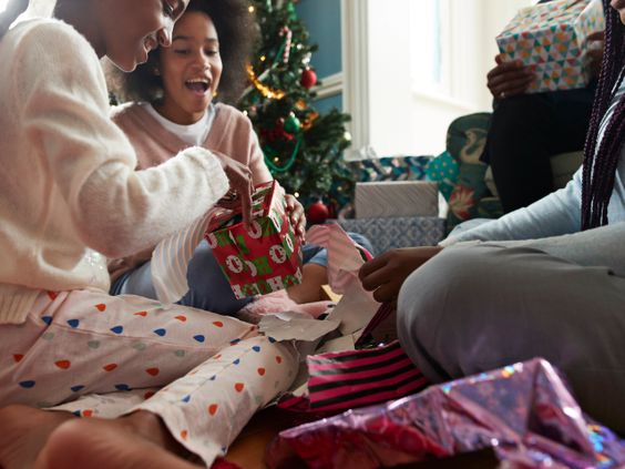 Needy children in Michigan celebrate getting their gifts for Christmas