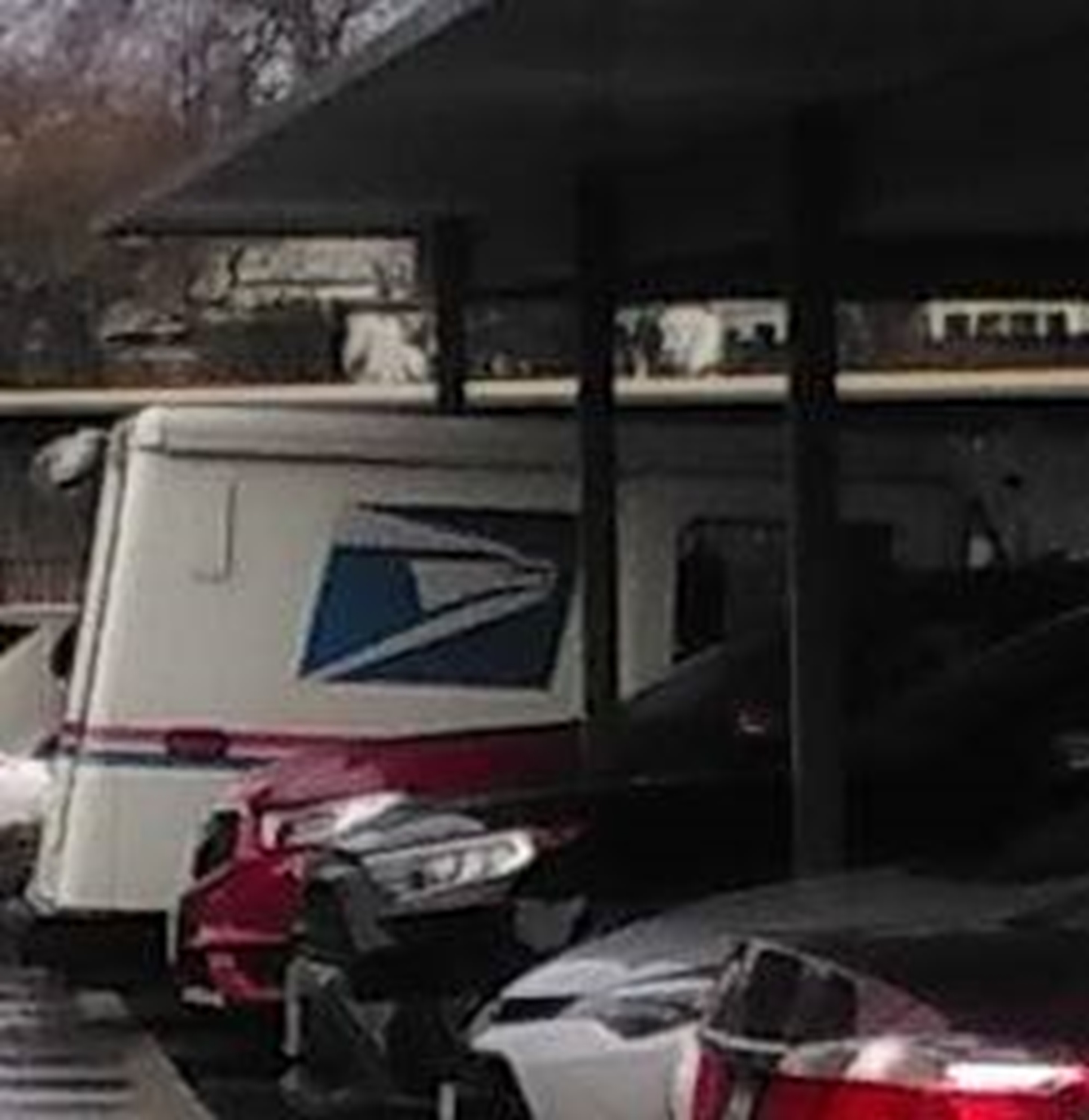 Photo I took of the mail truck parked near the mailboxes where I get my mail. 