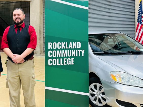 U S Navy veteran Michael J Finlay with his new auto at Rockland Community College