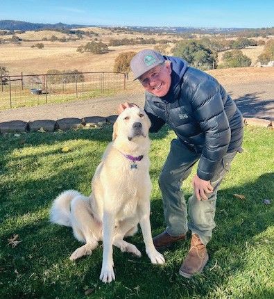 A dog named Chance who now goes by the name Hank with his new owner 