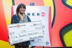 A Maryland lottery winner named Cher with her Powerball ticket