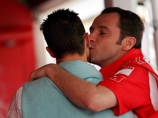 Schumacher being kissed by a pit crew - Funny photo!
