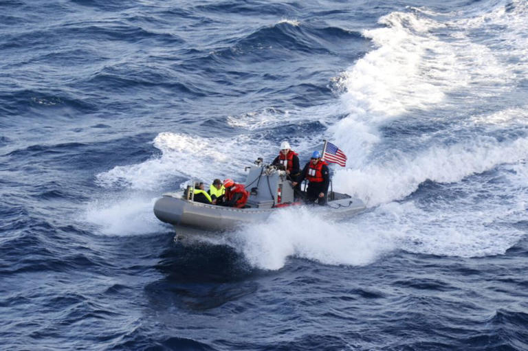 USS Navy destroyer Curtis Wilbur rescues 2 persons who are at sea in California