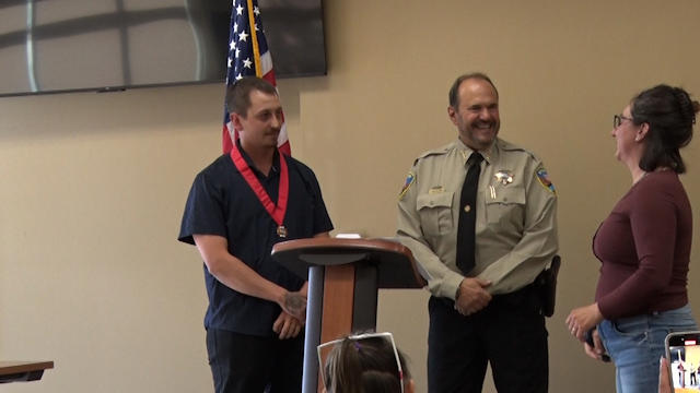 A Colorado resident receives a life saving award from the police in Rifle CO