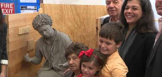Maria Pulsone and her relatives with a sculpture in New York City
