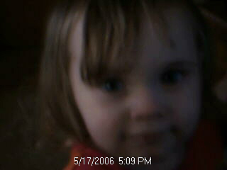 Mia Ellen - This is a picture of my daughter right before running off and getting into my stack of books. She is so cute when planning something. LOL
