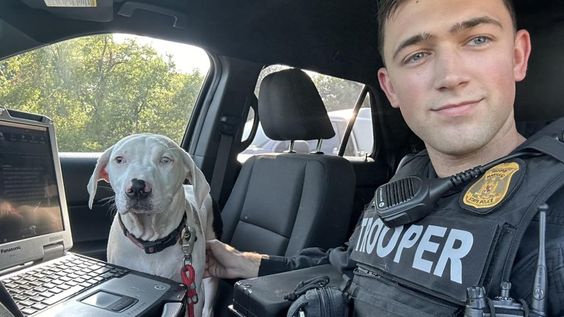 Maryland Police Officer Shane McGregor saves a dog that was inside a locked auto. Maryland Police Officer Shane McGregor saves a dog that was inside a locked auto.