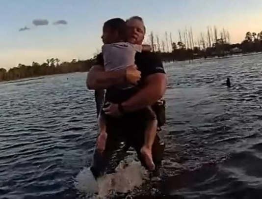 Volusia County Sheriffs Department officer Brough rescues a child who fell into a pond Volusia County Sheriffs Department officer Brough rescues a child who fell into a pond