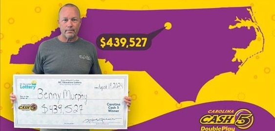 Benny Murphy with his winning lottery prize in North Carolina. Benny Murphy with his winning lottery prize in North Carolina.