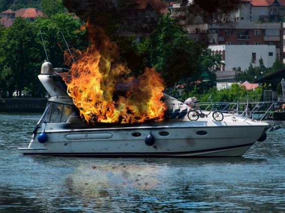 A yacht on fire at a pier in Clearwater Harbor Florida A yacht on fire at a pier in Clearwater Harbor Florida