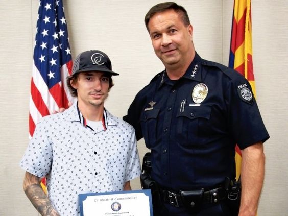 Dakota McDonald receives an award from the Peoria Police in Arizona Dakota McDonald receives an award from the Peoria Police in Arizona