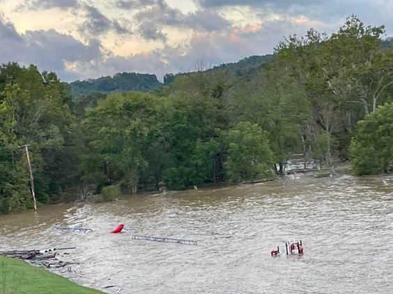 Eddie Hunnell rescues a lady who was trapped inside a home during a flood. Eddie Hunnell rescues a lady who was trapped inside a home during a flood.