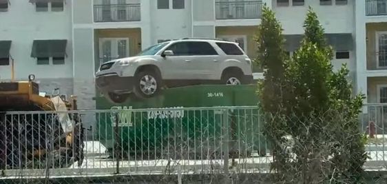 SUV placed on top of a dumpster in Fort Myers Florida SUV placed on top of a dumpster in Fort Myers Florida