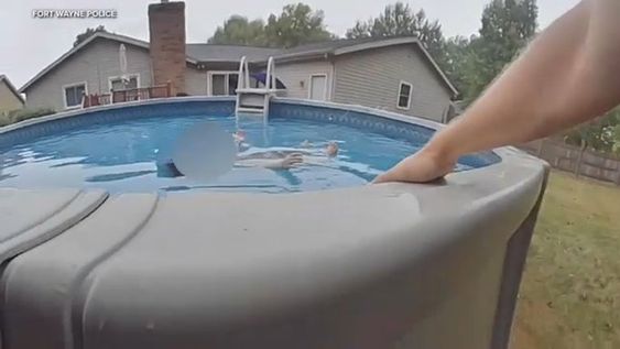 A police officer in Ohio rescues a boy in a swimming pool