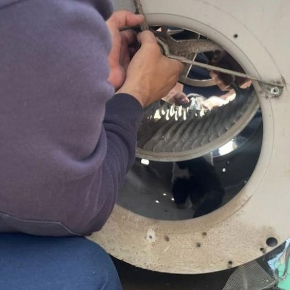 Firefighters in New Mexico rescue a cat that was trapped inside of a HVAC unit