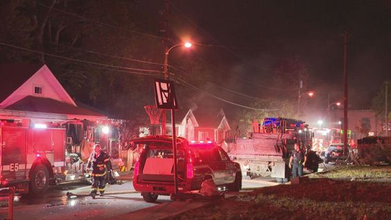 Firetrucks outside a house that caught fire in Lexington Kentucky. 