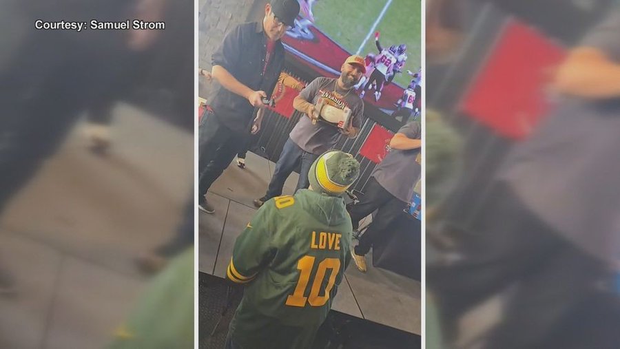 Green Bay Packers fan John De La Rosa receives gifts from football fans. Green Bay Packers fan John De La Rosa receives gifts from football fans.