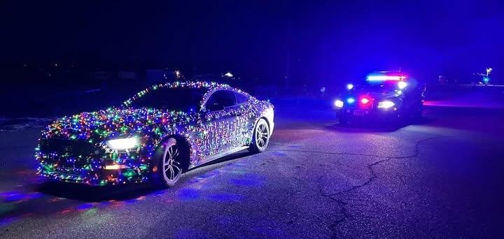 Auto in a road in Wyoming gets pulled over by a state police officer.