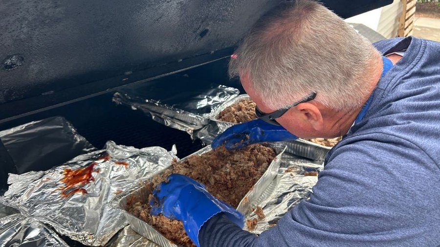 Durham County Rescue Mission volunteer cooks up a meal for hurricane victims.