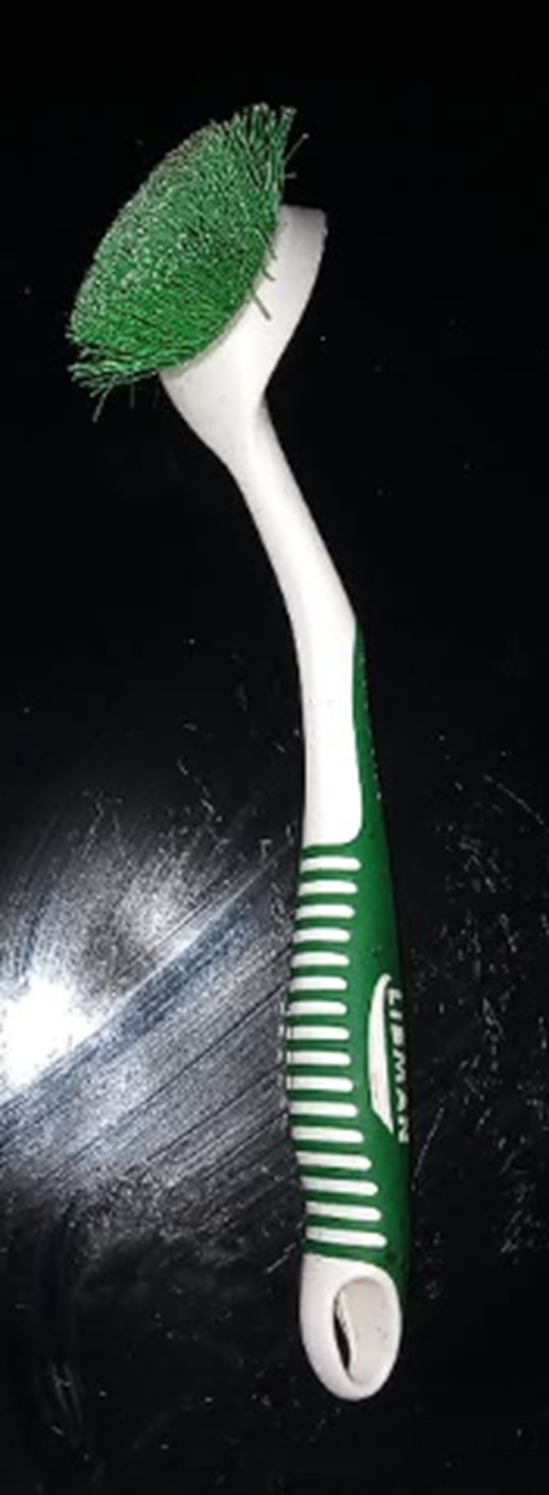 Photo I took of the scrub brush on the stove top Photo I took of the scrub brush on the stove top