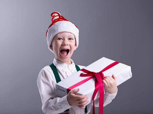 A child with his Christmas gift.