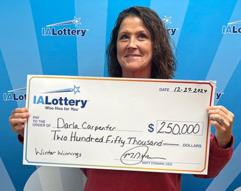 Lottery winner Darla Carpenter with a huge lottery prize in Iowa. 