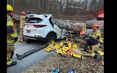 Firefighters rescue a woman trapped inside of an auto in Tennessee 