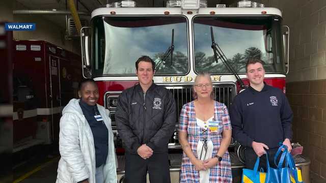 Hudson management hands first responders gift baskets to them as a thank you note Hudson management hands first responders gift baskets to them as a thank you note
