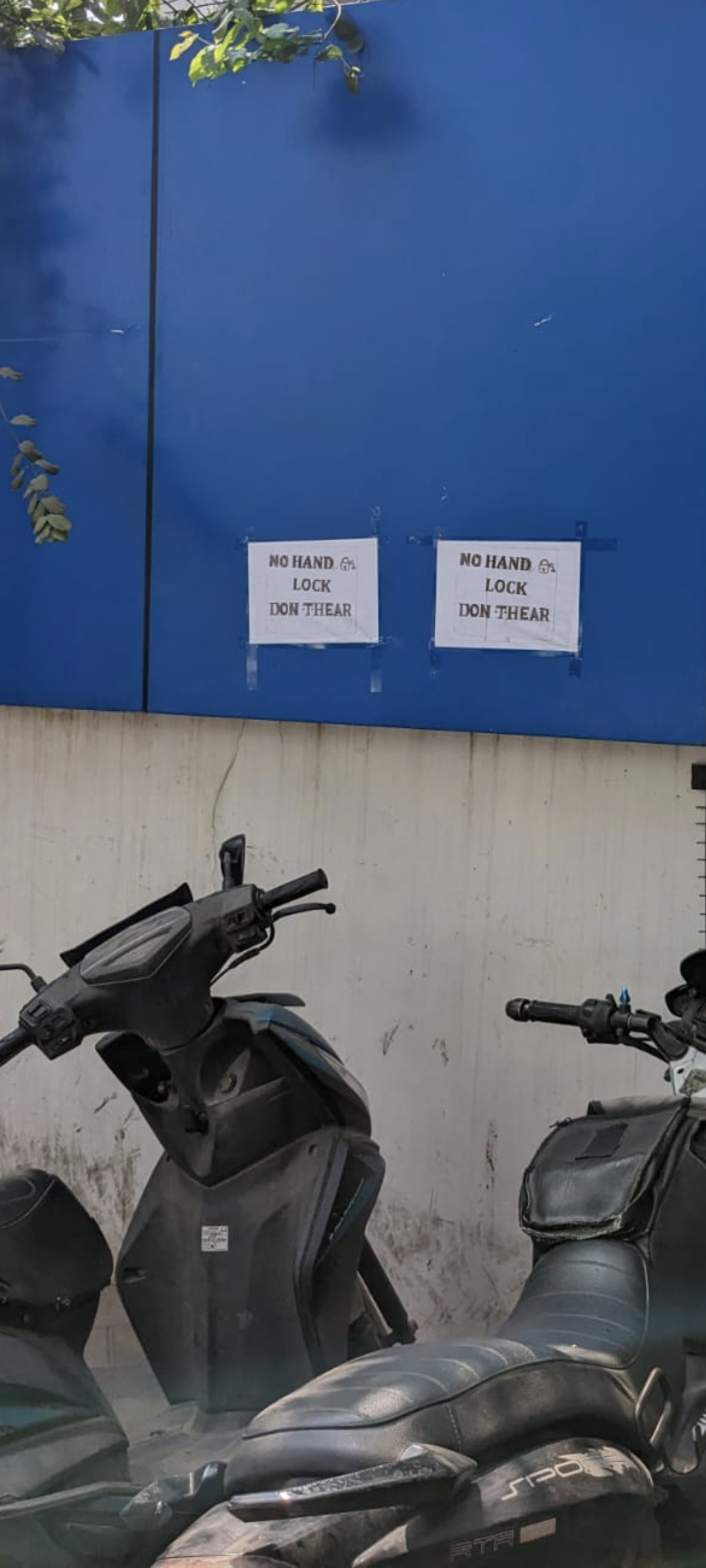 Funny bike parking sign